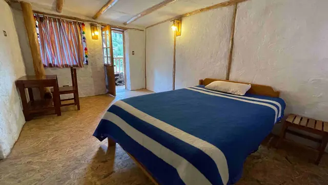 Habitación matrimonial de la casa de campo Unu Samay en Urubamba
